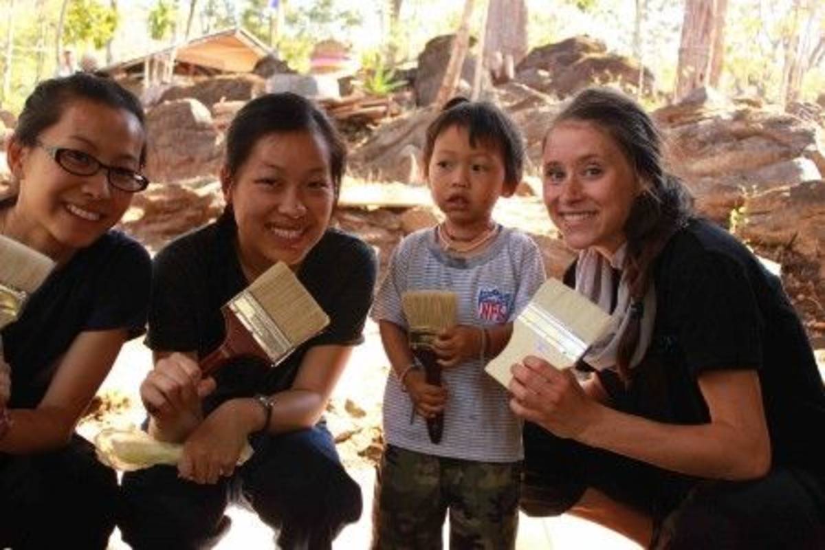 Volunteers and a kid