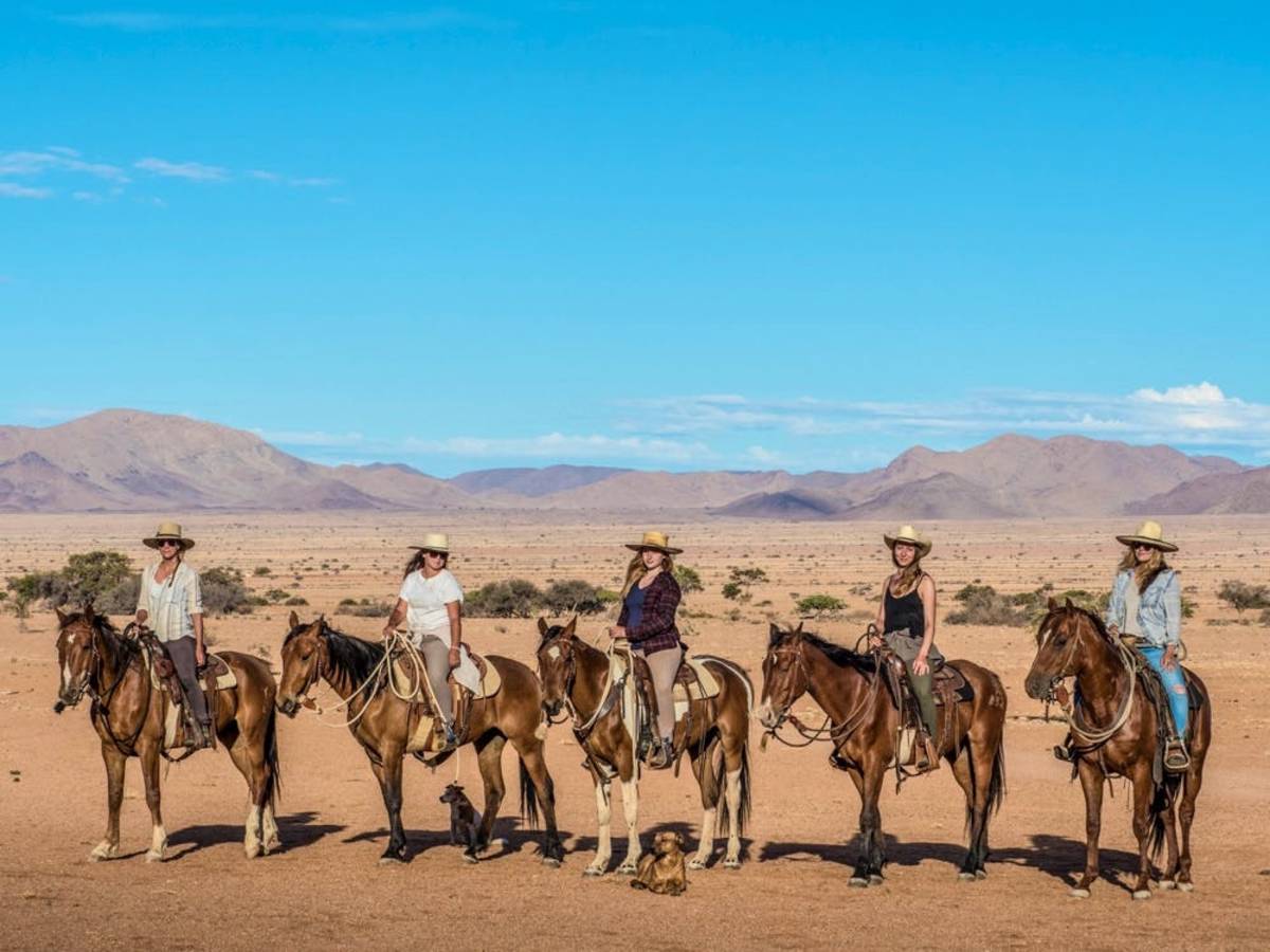 Volunteers horse riding