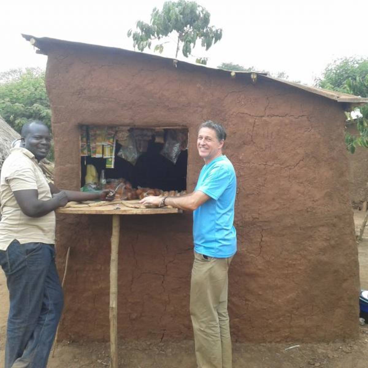 Volunteer at a local shop in rural Uganda, Africa