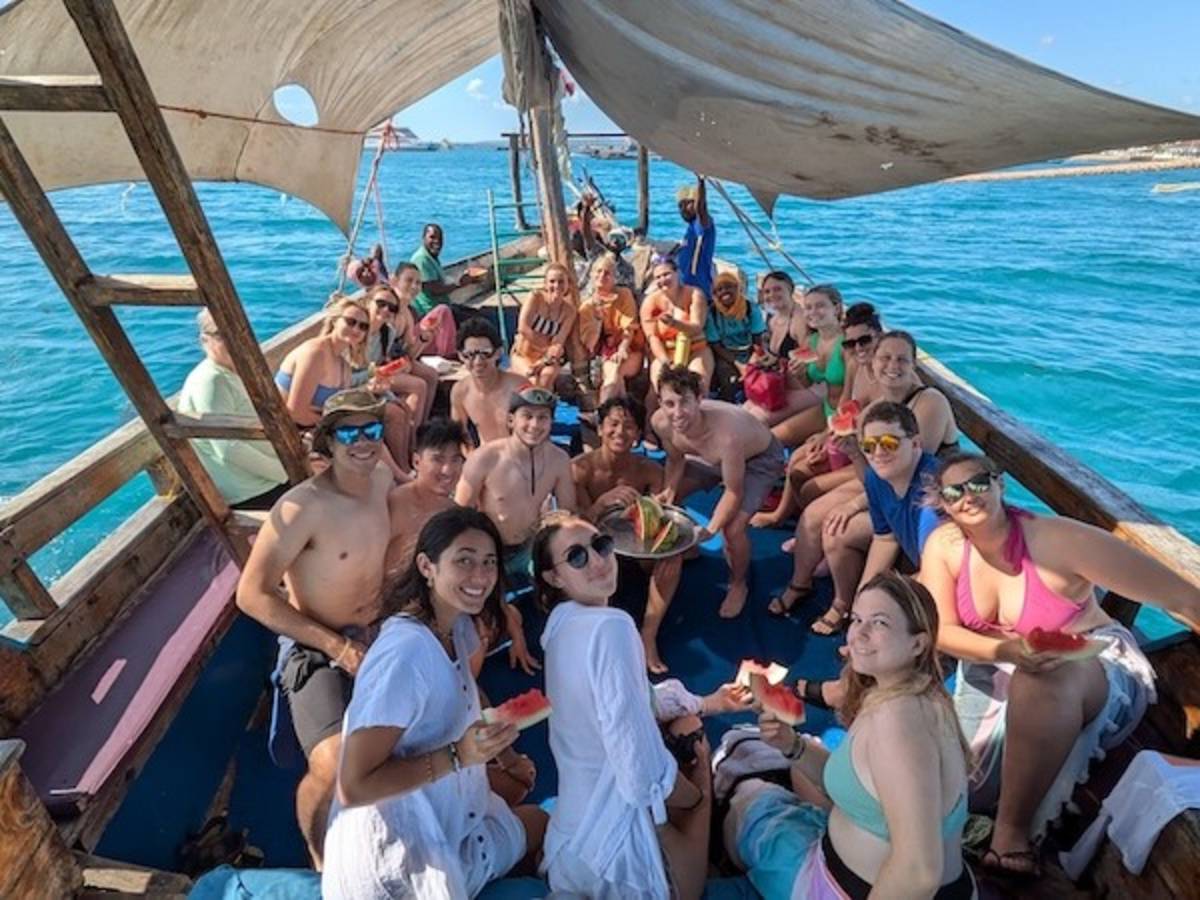 Volunteers on local longboat excursion in Tanzania