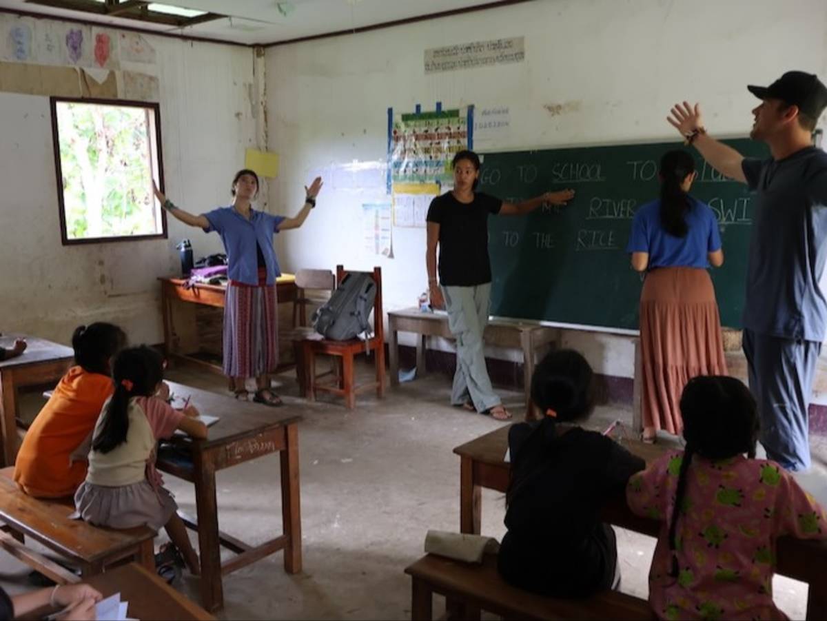 Volunteers teaching English at a local school in rural Laos