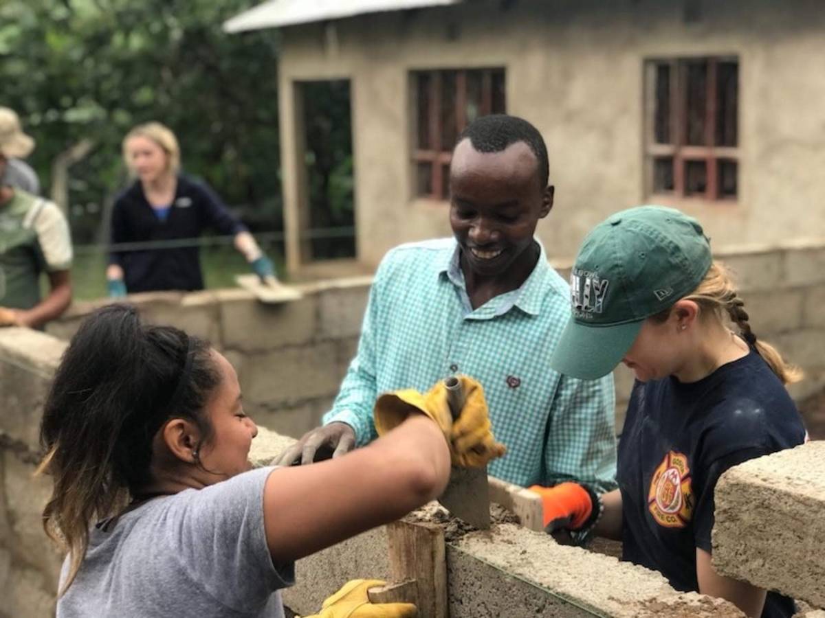 Volunteers working on Tanzania school construction projects with local