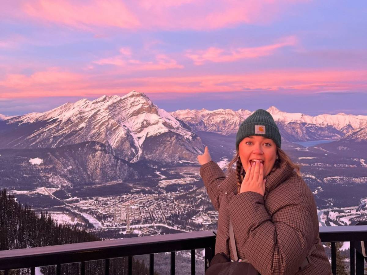 Woman in front of a mountain at sunset