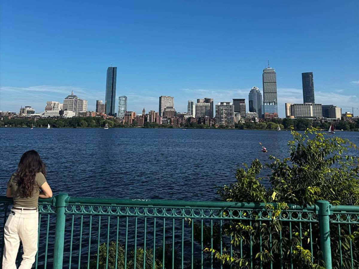 Woman looking out at NYC skyline
