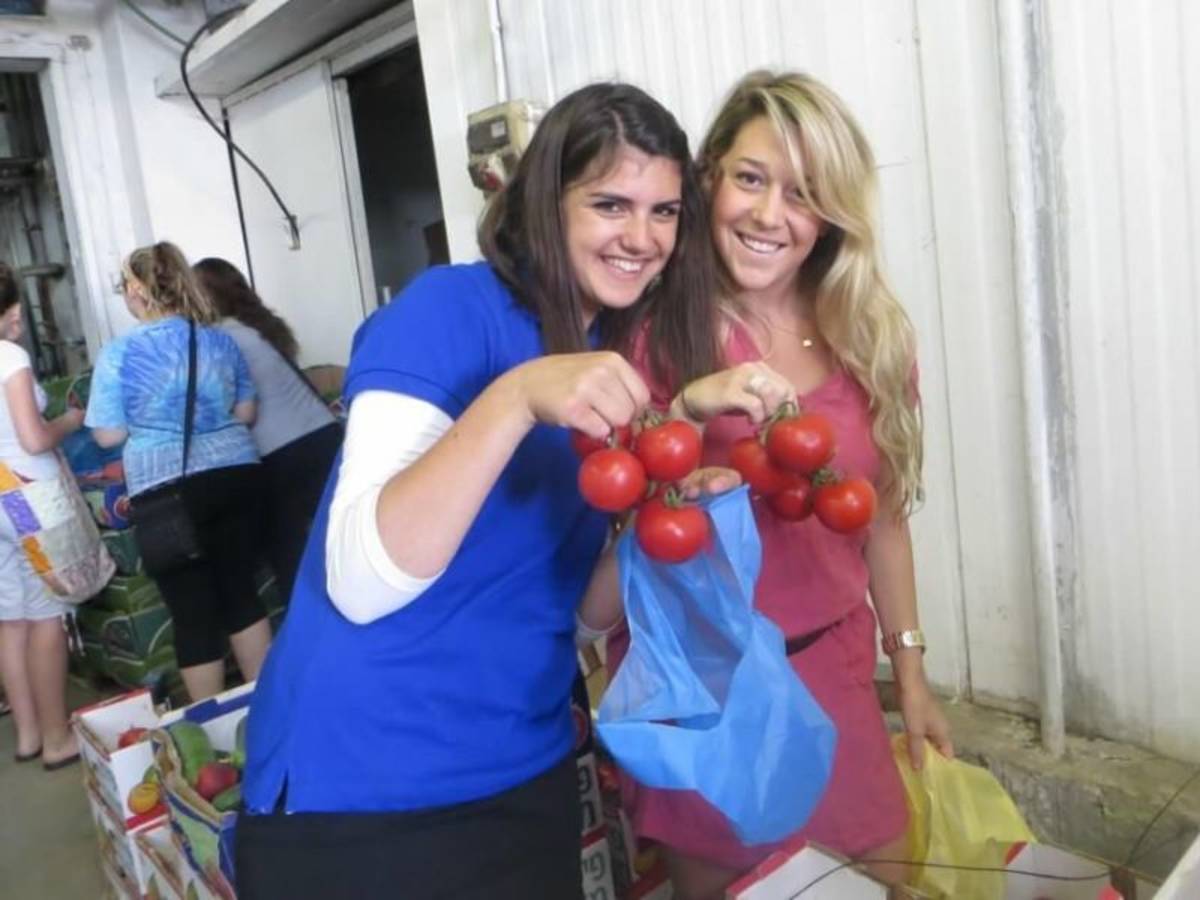 women holding fuits