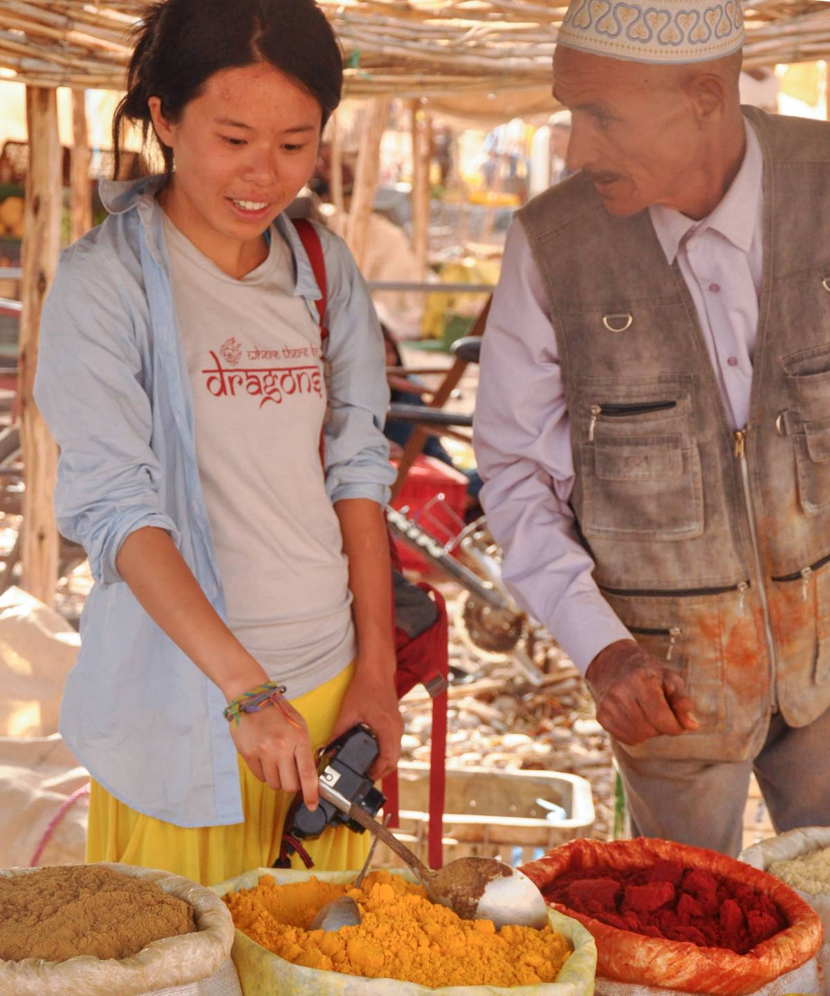 young girl learning how to cook with mentor