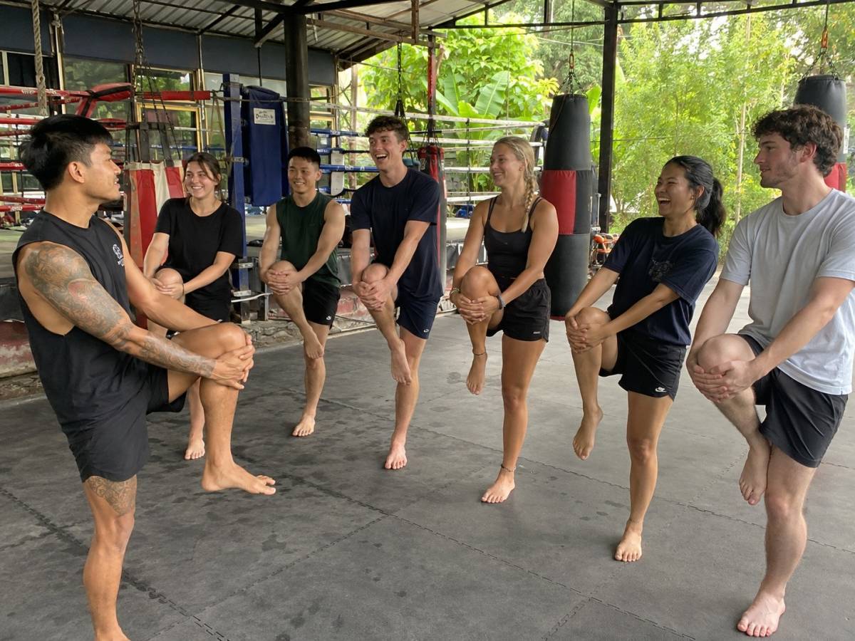 Young travellers joining a Muay Thai class in Thailand