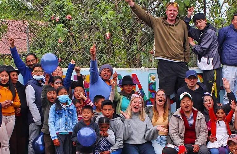 photo of a man with the mountains behind him