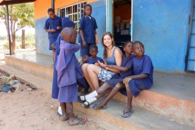 An image of a volunteer with kids