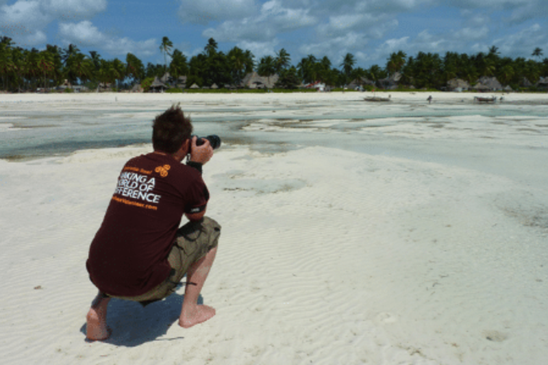A man taking pictures on beach