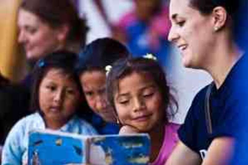 Reading with children education outreach for child workers Ecuador