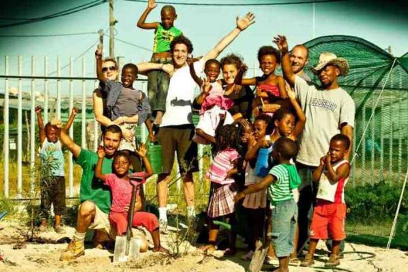 group of volunteer and children at program site