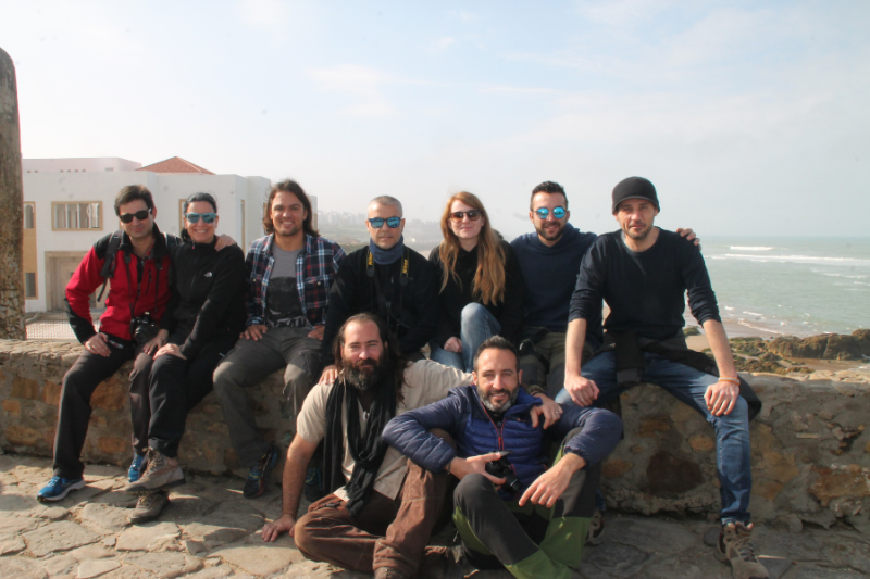 a group of people taking a scenic field photo