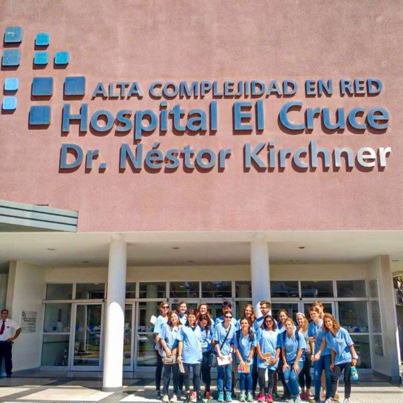A group of SIT students posing in front of a hospital.