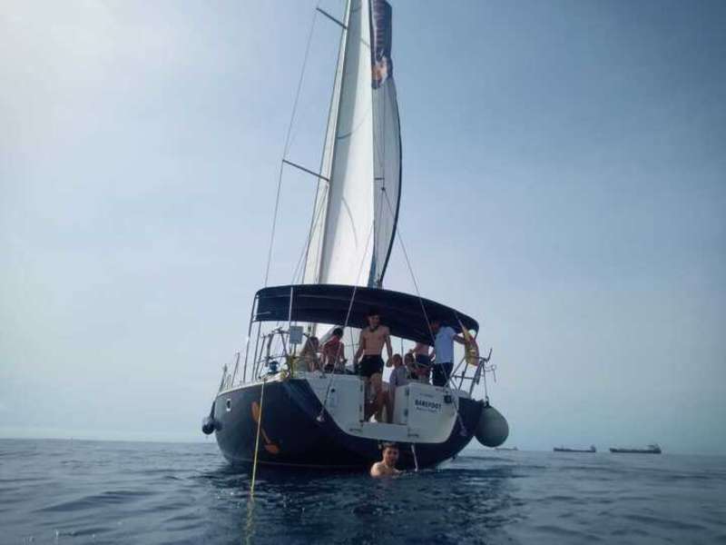 a group poses for a photo on a boat 