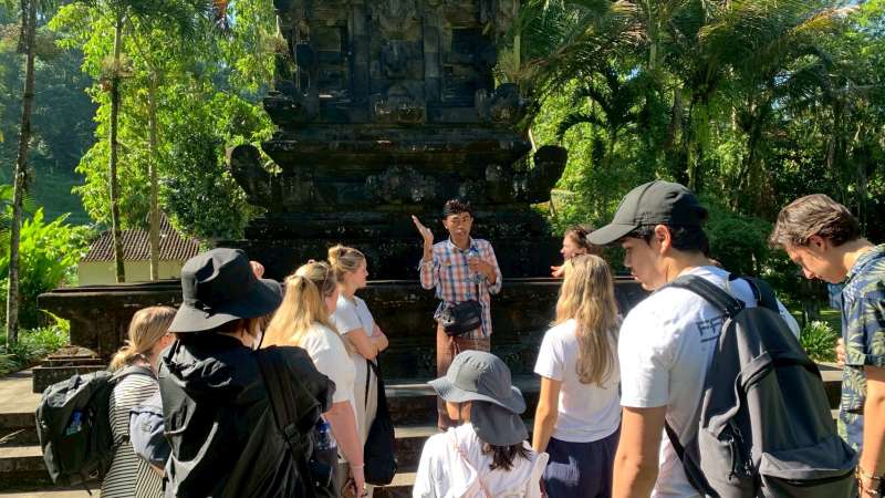 a guide giving a tour at a temple