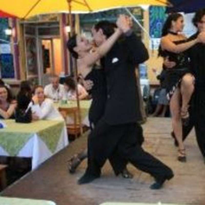 A lively group dancing in a restaurant.