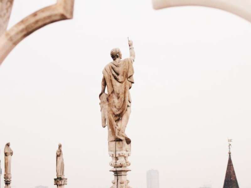 A Milanese sculpture looks over a cloudy sky.