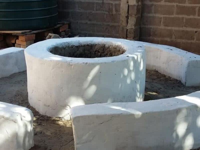 a newly painted white well