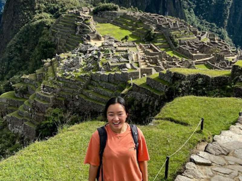 a student in front of the Machu Picchu Incan ruins