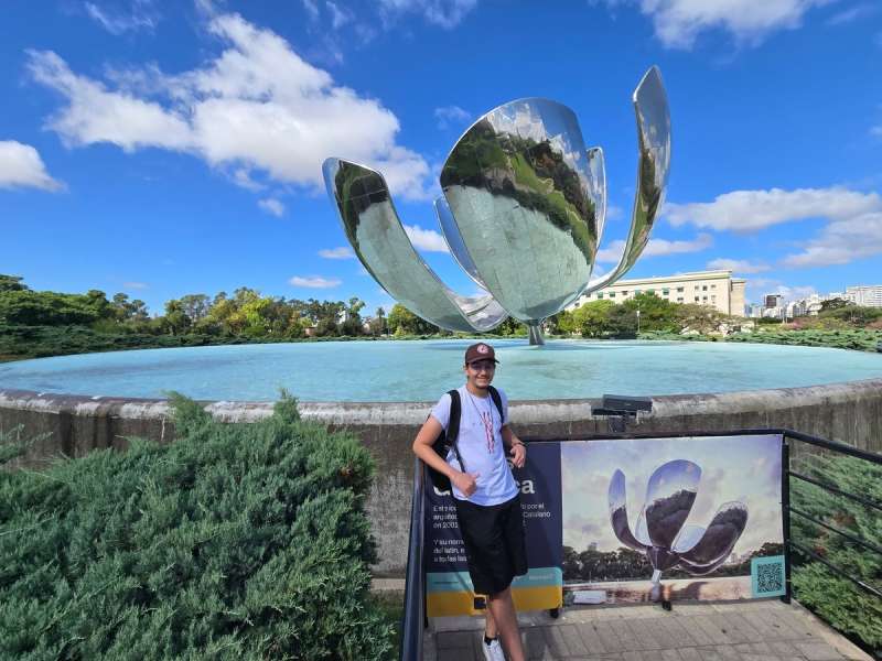 A student stands in front of Floralis Generica in Buenos Aires, Argentina.