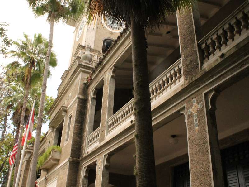 A university building with palm trees