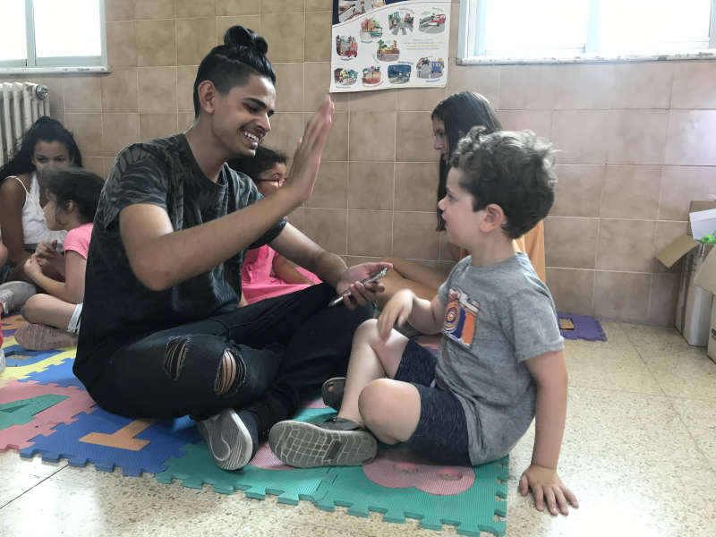 AFS Students participating in language activities with grade schoolers