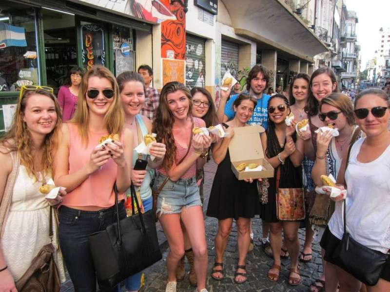 AIFS Abroad study abroad students in Buenos Aires, Argentina eating traditional empanadas