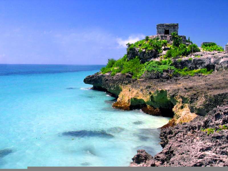 Ancient Mayan ruins overlooking turquoise Caribbean waters in Tulum, Mexico, a top destination for TEFL teachers