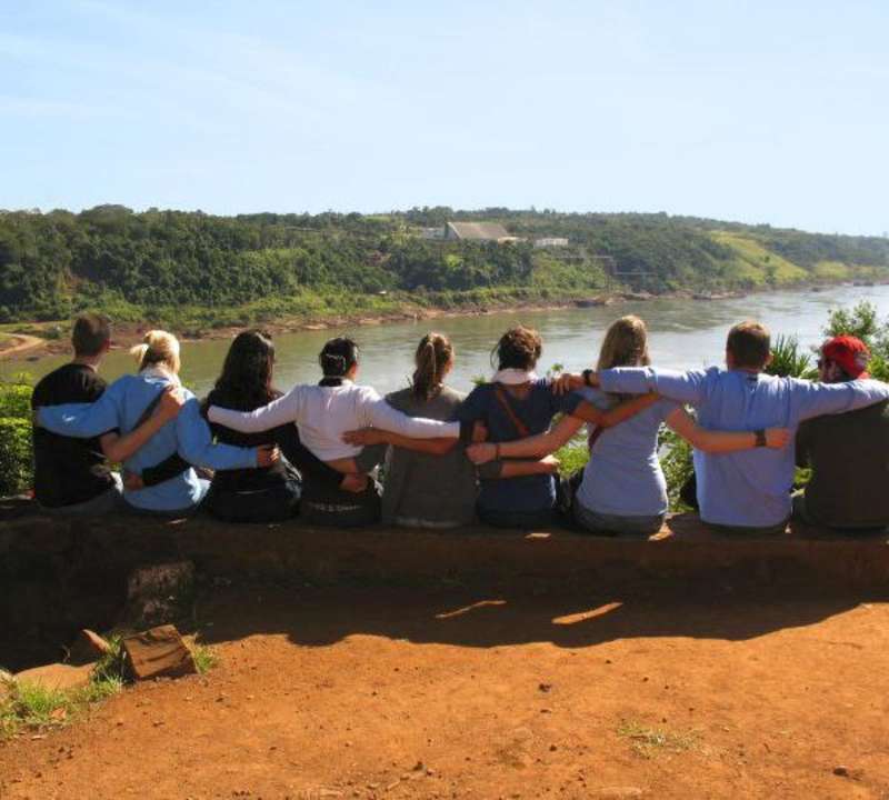 Students sitting at Iguazú Falls