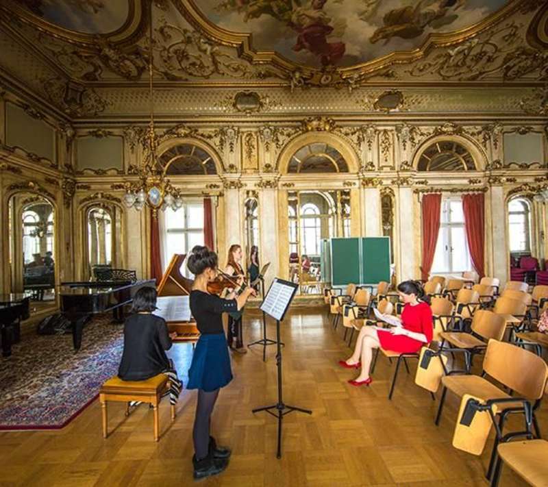 Students playing music in classroom