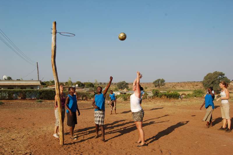 Volunteers playing basketball with the locals