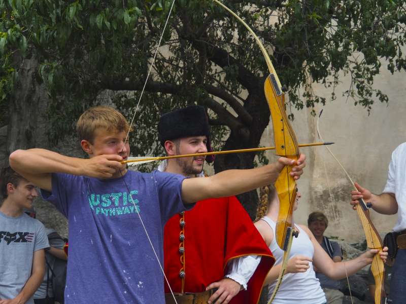 Boy learning archery in Croatia