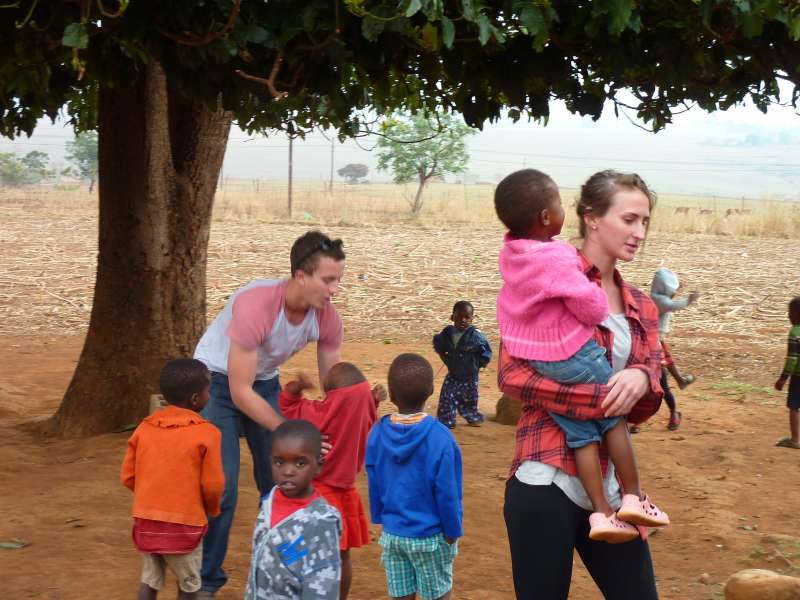 Volunteer carrying children