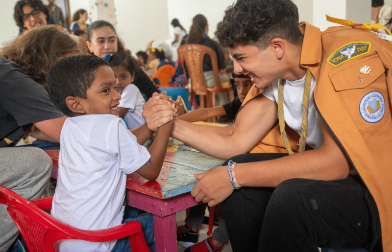 Children engaged in a classroom activity with a teacher
