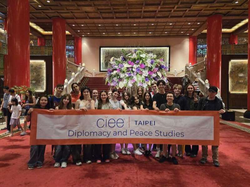 CIEE high schoolers on program in Taipei posing with sign
