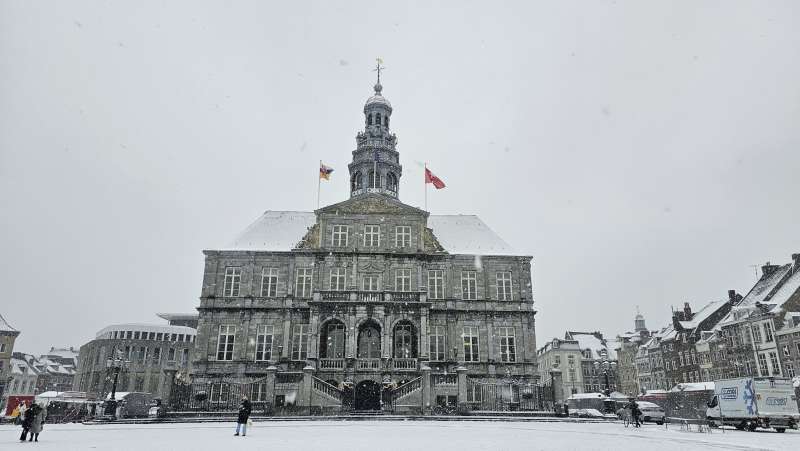 City hall at the Markt square in Maastricht on a snowy day