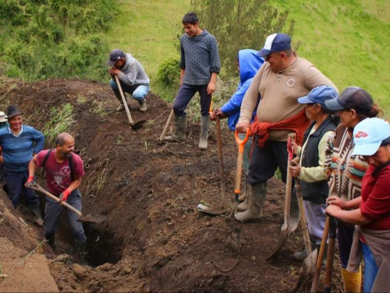 community-minga-digging-trench-ecuador