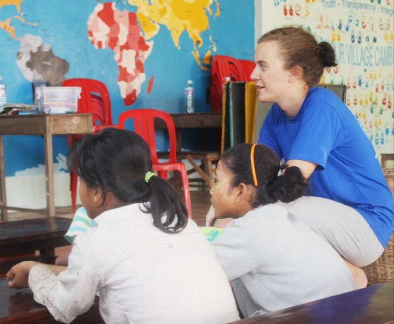 Volunteer with  two kids at class