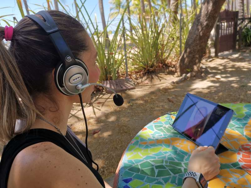 an online language lesson by the beach