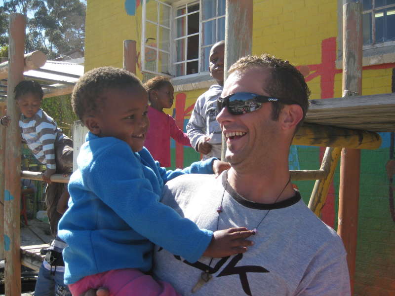 Intern with a local child