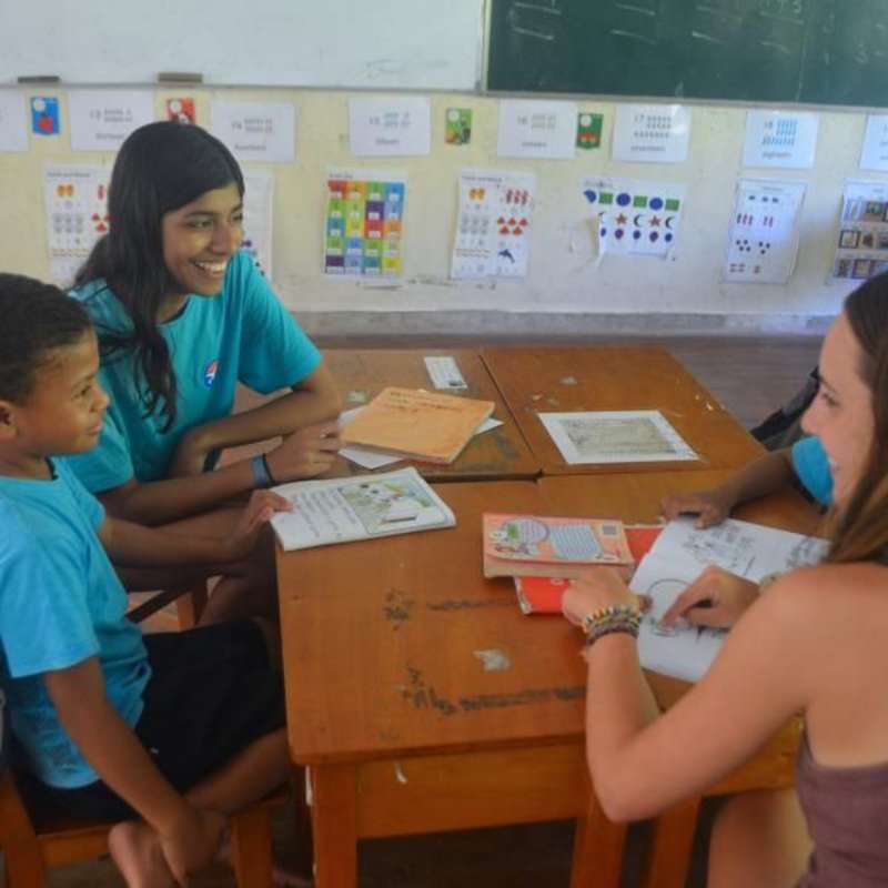 teen teaching elementary school students in Fiji