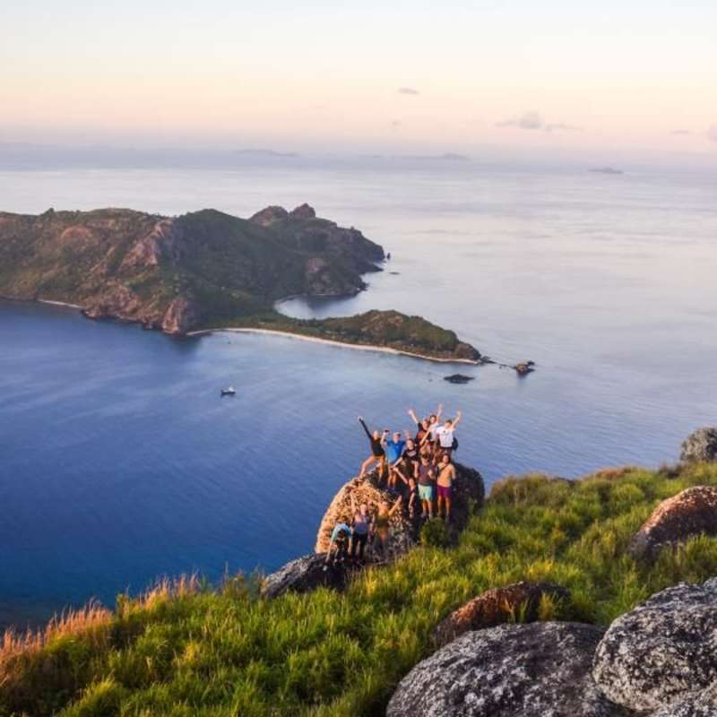 group of teens on the coast of Fiji on a summer travel tour