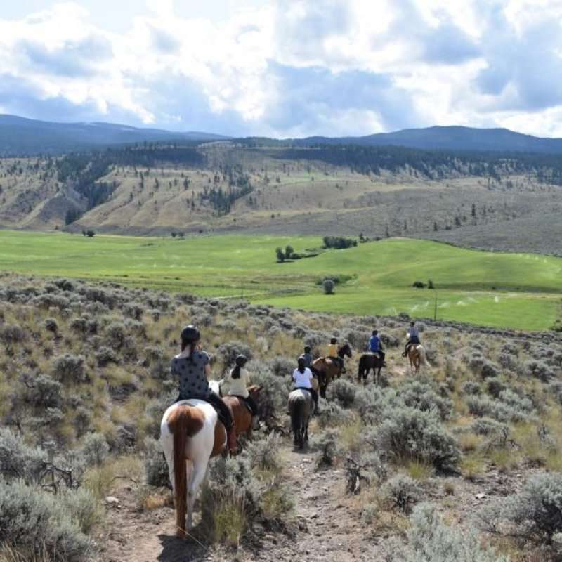 teens horseback ride in canada on a summer travel tour