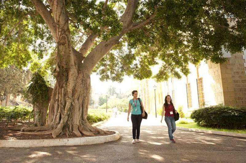 Students pass by West Hall