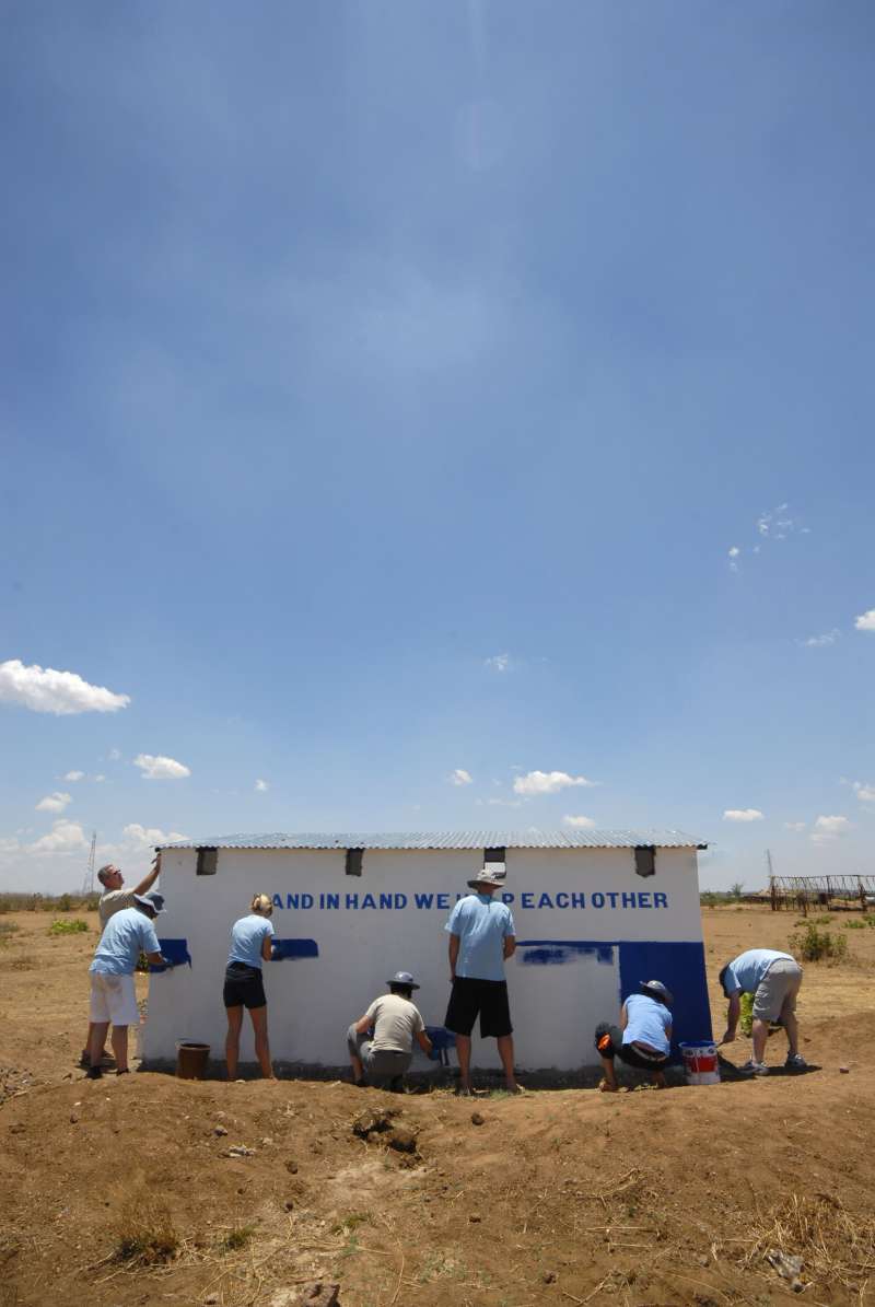 Volunteers painting the building