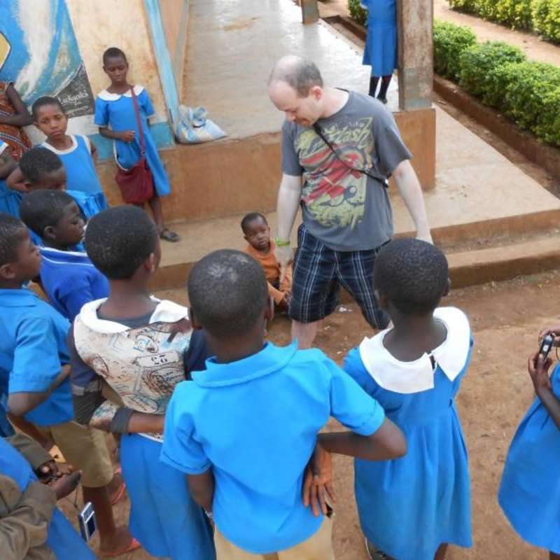 volunteer teacher with school kids