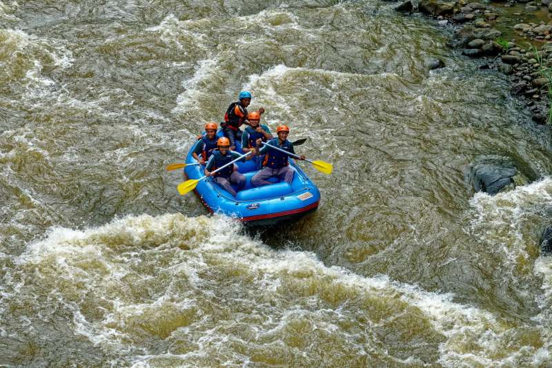 Five people whitewater rafting in Germany