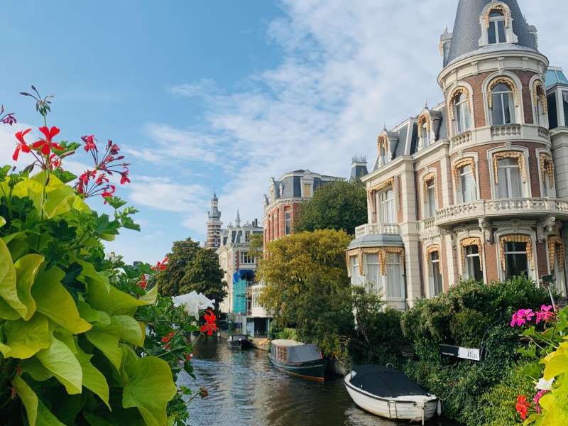 Flowers in front of a canal in Amsterdam, Netherlands.
