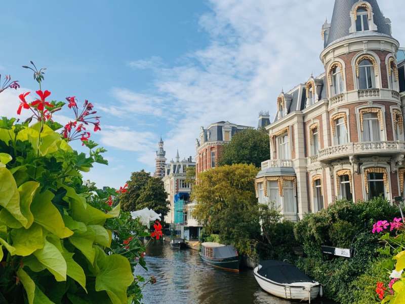 Flowers in front of a canal in Amsterdam.
